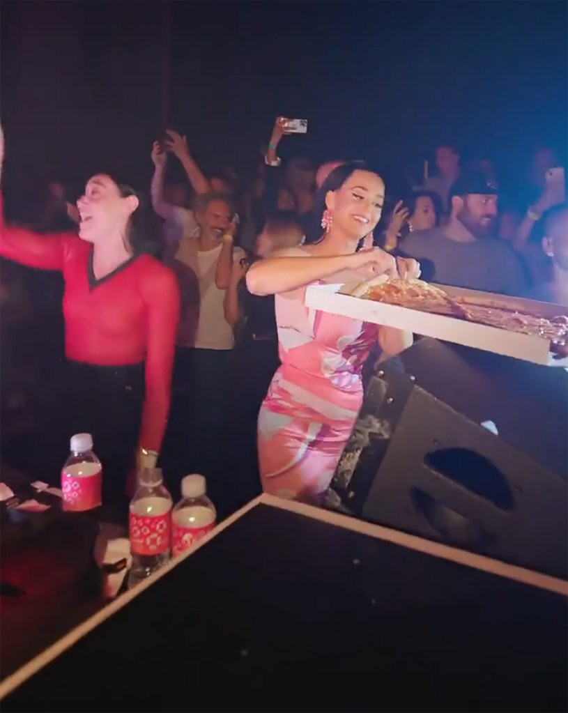 Katy Perry throwing pizza slices into a crowd at a Las Vegas nightclub.