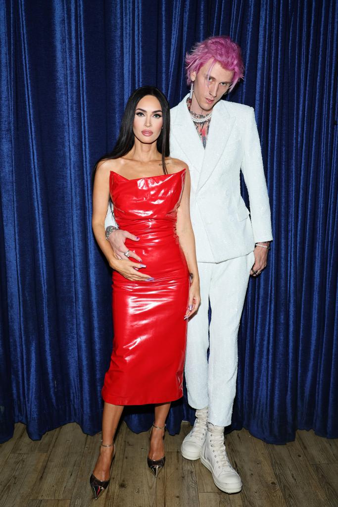 Megan Fox and Machine Gun Kelly posing for a photo together