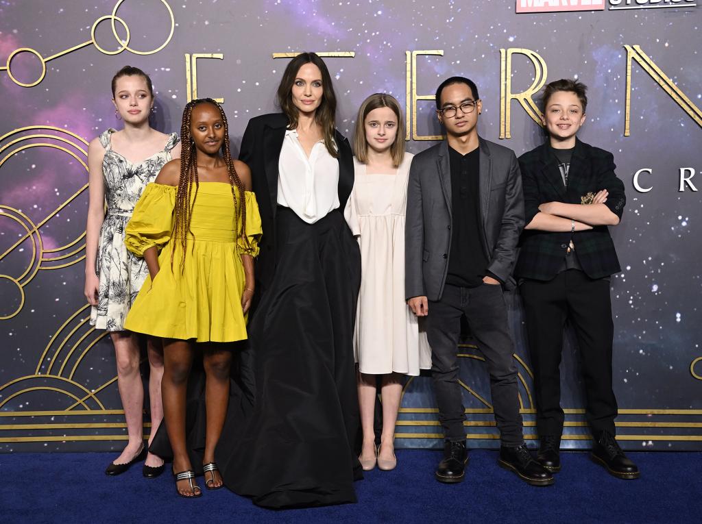 Angelina Jolie and kids Maddox, Zahara, Shiloh, Knox and Vivienne on a red carpet.