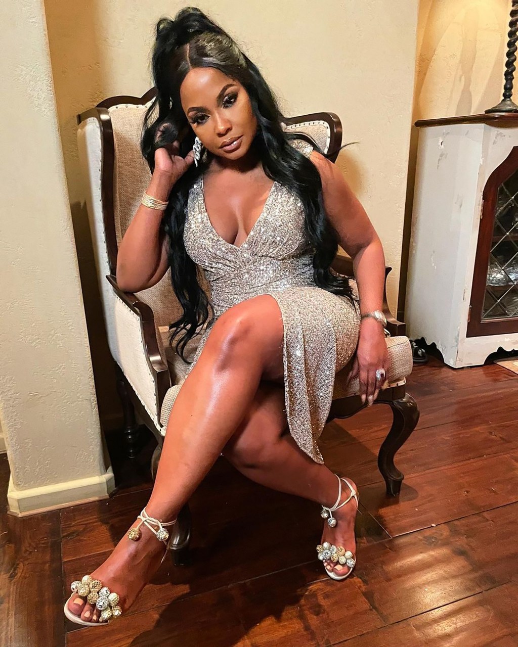 Phaedra Parks sitting in a chair.