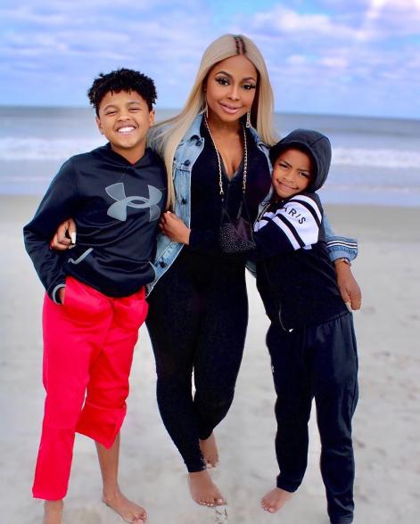 Phaedra Parks posing on a beach with sons Ayden and Dylan.