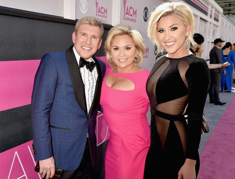 Julie and Todd and Savannah Chrisley posing for a photo together