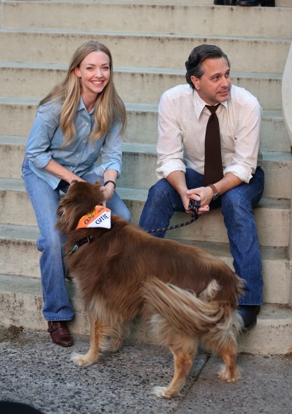 Amanda Seyfried and Thomas Sadoski are seen with their dog Finn on the set of "The Crowded Room" in Harlem on September 16, 2022 in New York City.