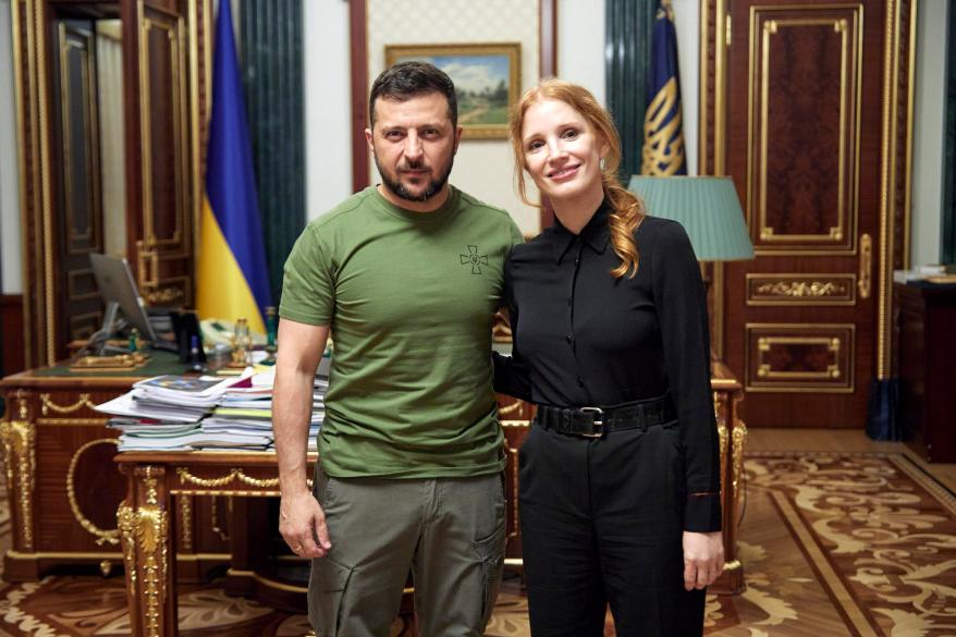 Jessica Chastain (at right) poses for a photo with Ukraine President Volodymyr Zelensky (at left)