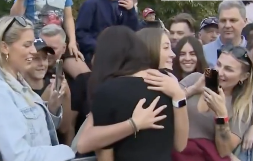 Meghan Markle was seen warmly embracing a teenage girl while greeting mourners near Windsor Castle.