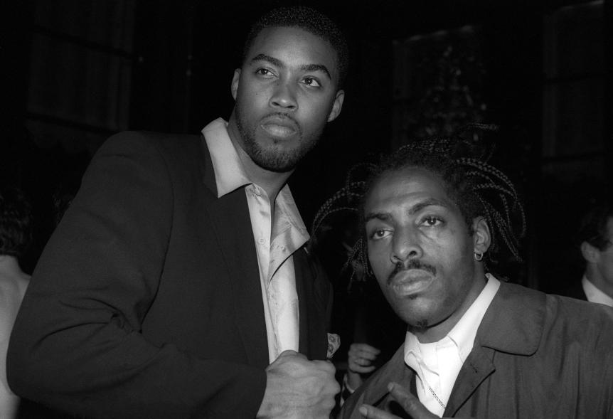 Montell Jordan and Coolio doing a handshake.