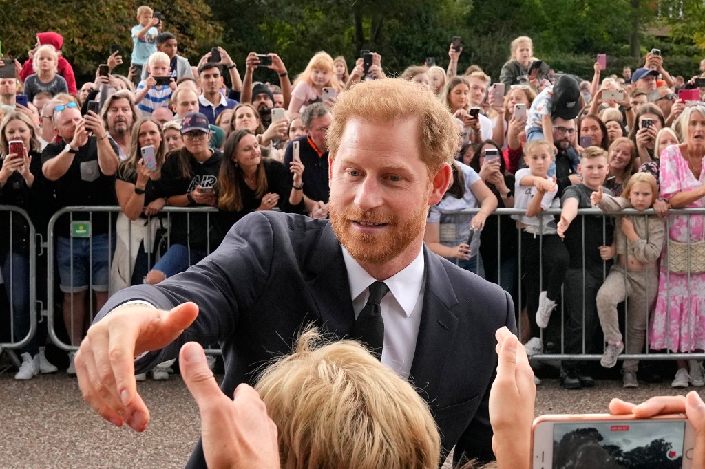 "[It's] a lonely place up there now without her," Prince Harry told mourners.