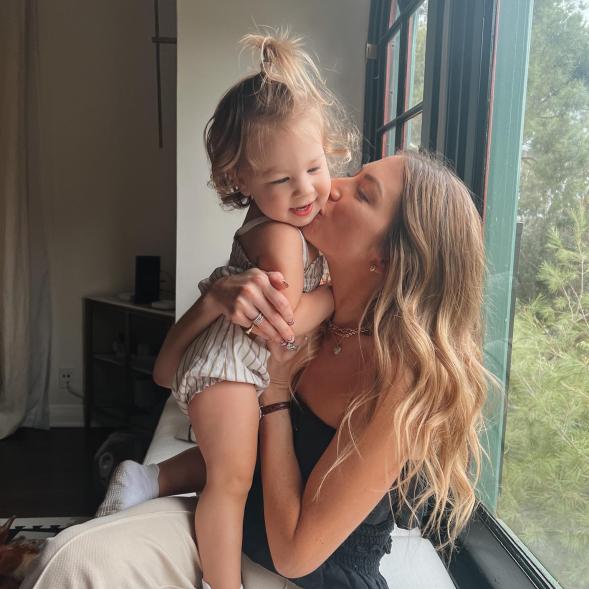 Stassi Schroeder posting for a photo with her daughter