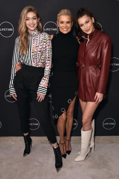 Gigi Hadid, Yolanda Hadid and Bella Hadid on a red carpet.