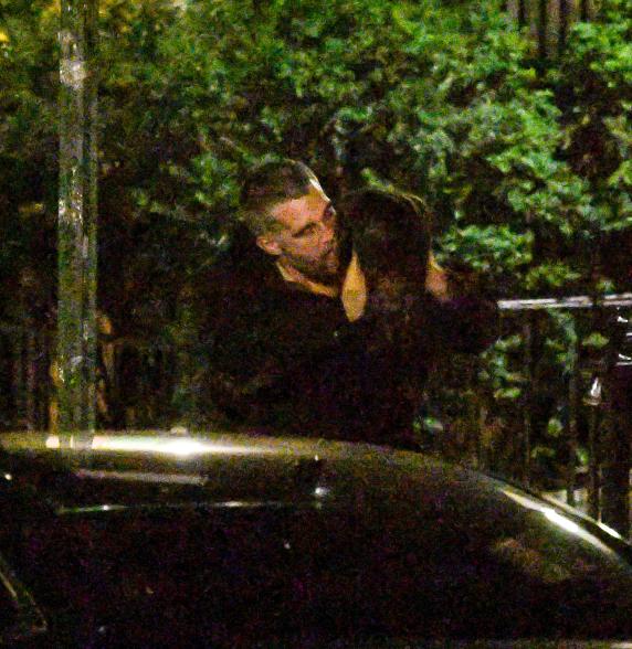 Emily Ratajkowski and Orazio Rispo kissing on the sidewalk