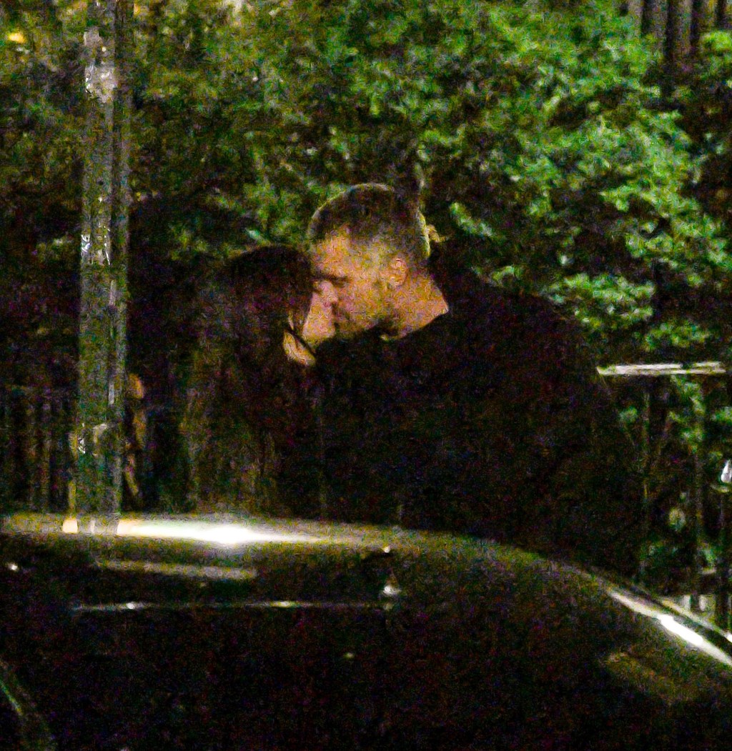 Emily Ratajkowski and DJ Orazio Rispo kissing each other