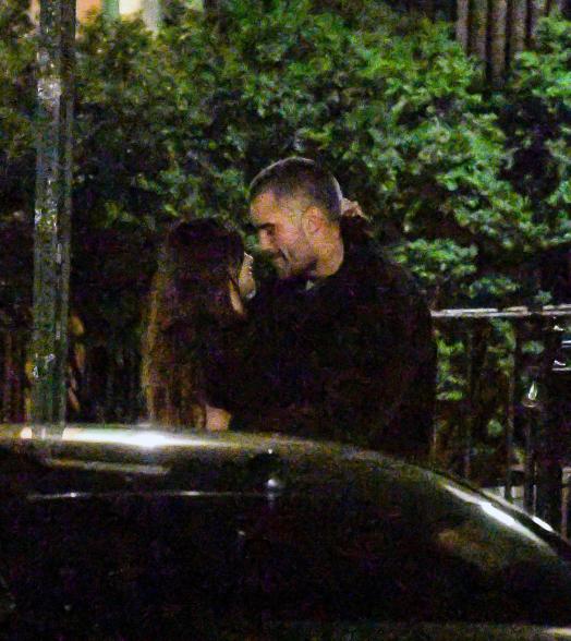 Emily Ratajkowski and DJ Orazio Rispo kissing.