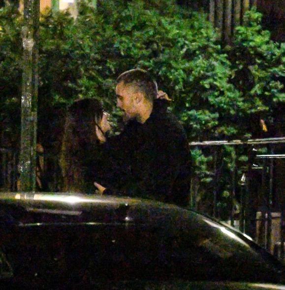 Emily Ratajkowski and DJ Orazio Rispo kissing.