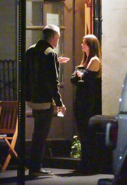 Emily Ratajkowski and Orazio Rispo talking outside dinner together