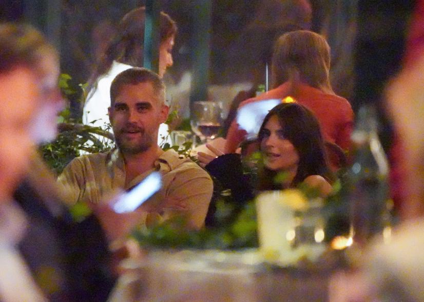 Emily Ratajkowski and Orazio Rispo talking at dinner together