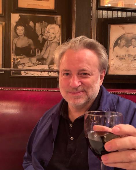 keith mcnally holding a glass of wine