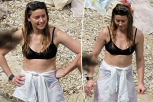 A split of Amber Heard on the beach in spain