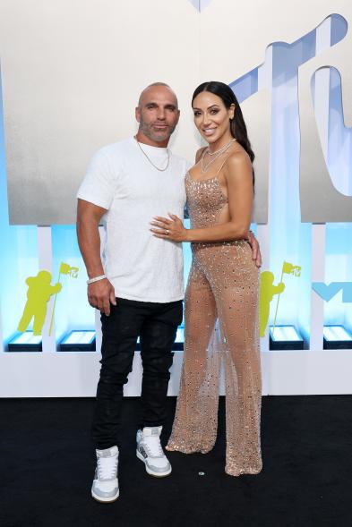 Joe Gorga and Melissa Gorga on a red carpet.