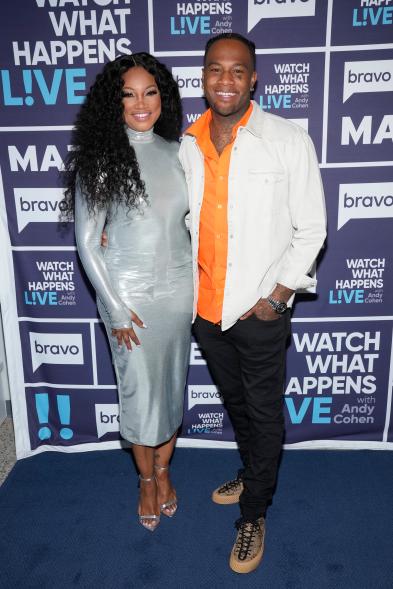 Garcelle Beauvais and Oliver Saunders on a red carpet.