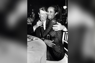 Iman and David Bowie embrace on Nov. 29, 1990.