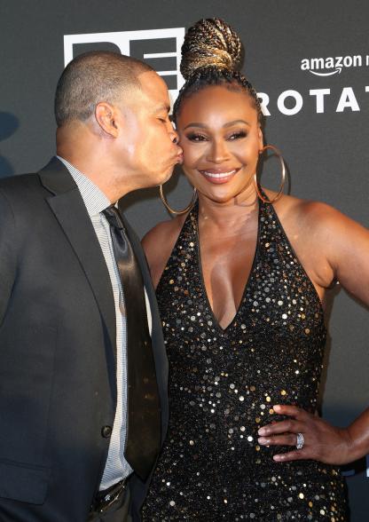 Cynthia Bailey and Mike Hill kiss on the cheek.