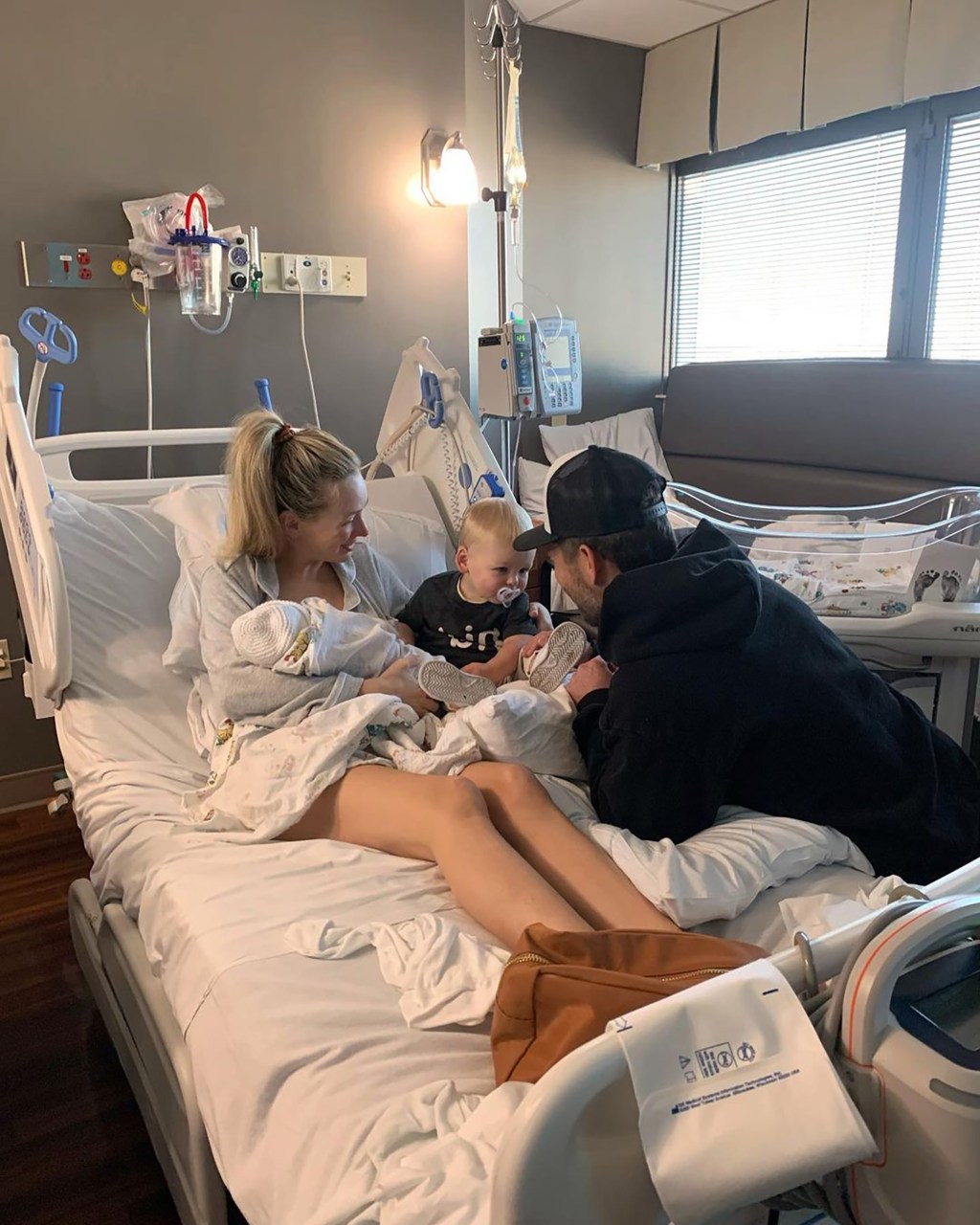 Lauren Bushnell and Chris Lane and kids at the hospital