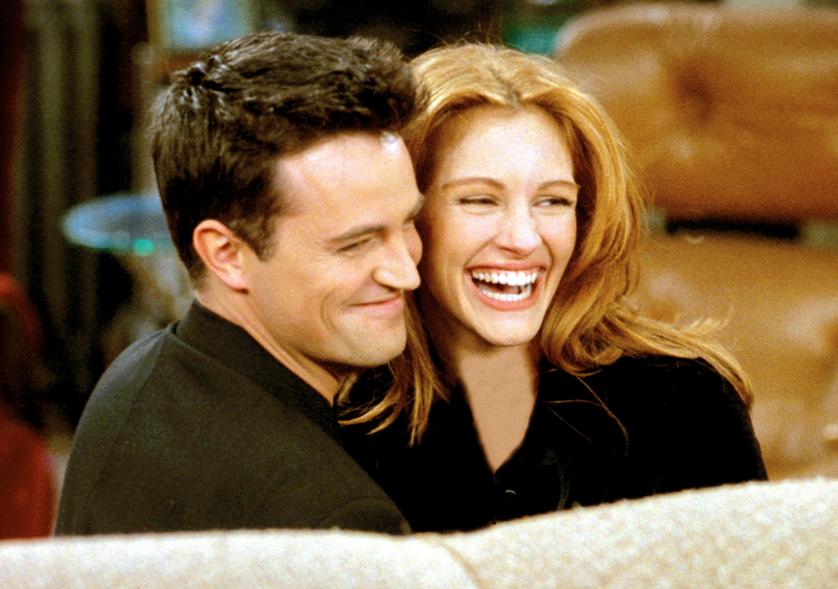 Matthew Perry and Julia Roberts laughing together on "Friends."