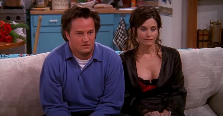 Courteney Cox and Matthew Perry sitting on a couch on "Friends."