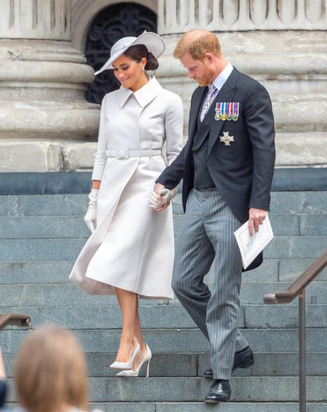 Meghan Markle and Prince Harry holding hands.