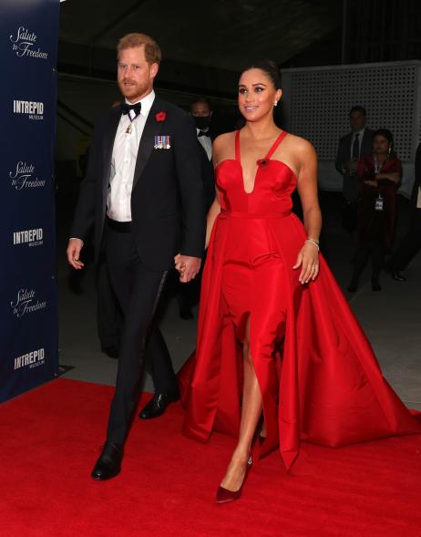 Meghan Markle and Prince Harry holding hands.