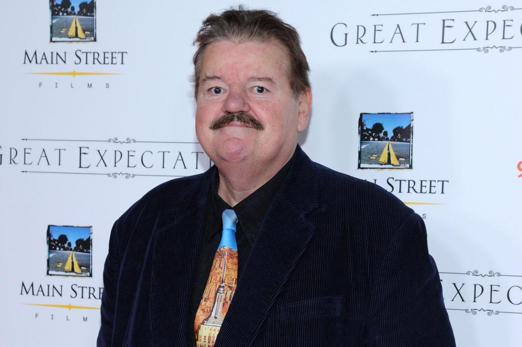 Robbie Coltrane on a red carpet.