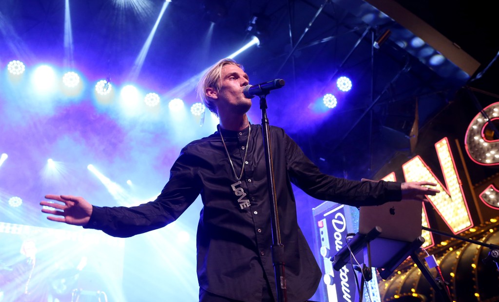 Aaron Carter performing on stage as an adult.