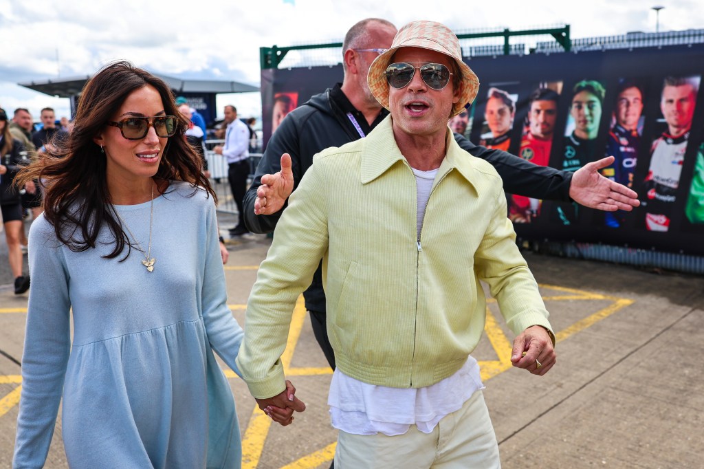 Ines de Ramon and Brad Pitt holding hands in 2024. 