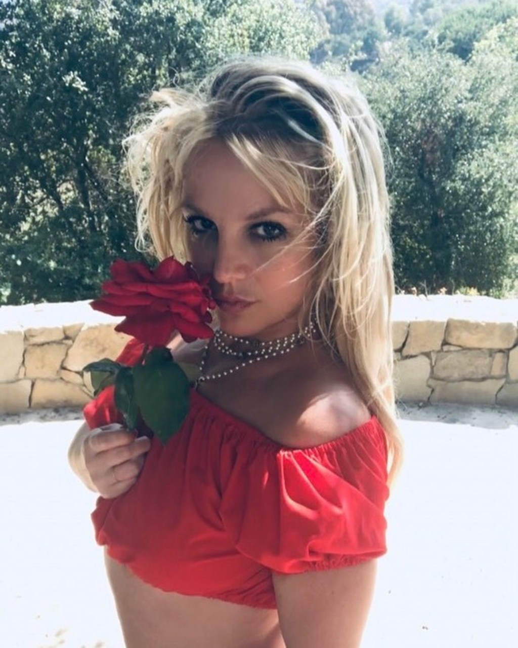 Britney Spears with a flower.