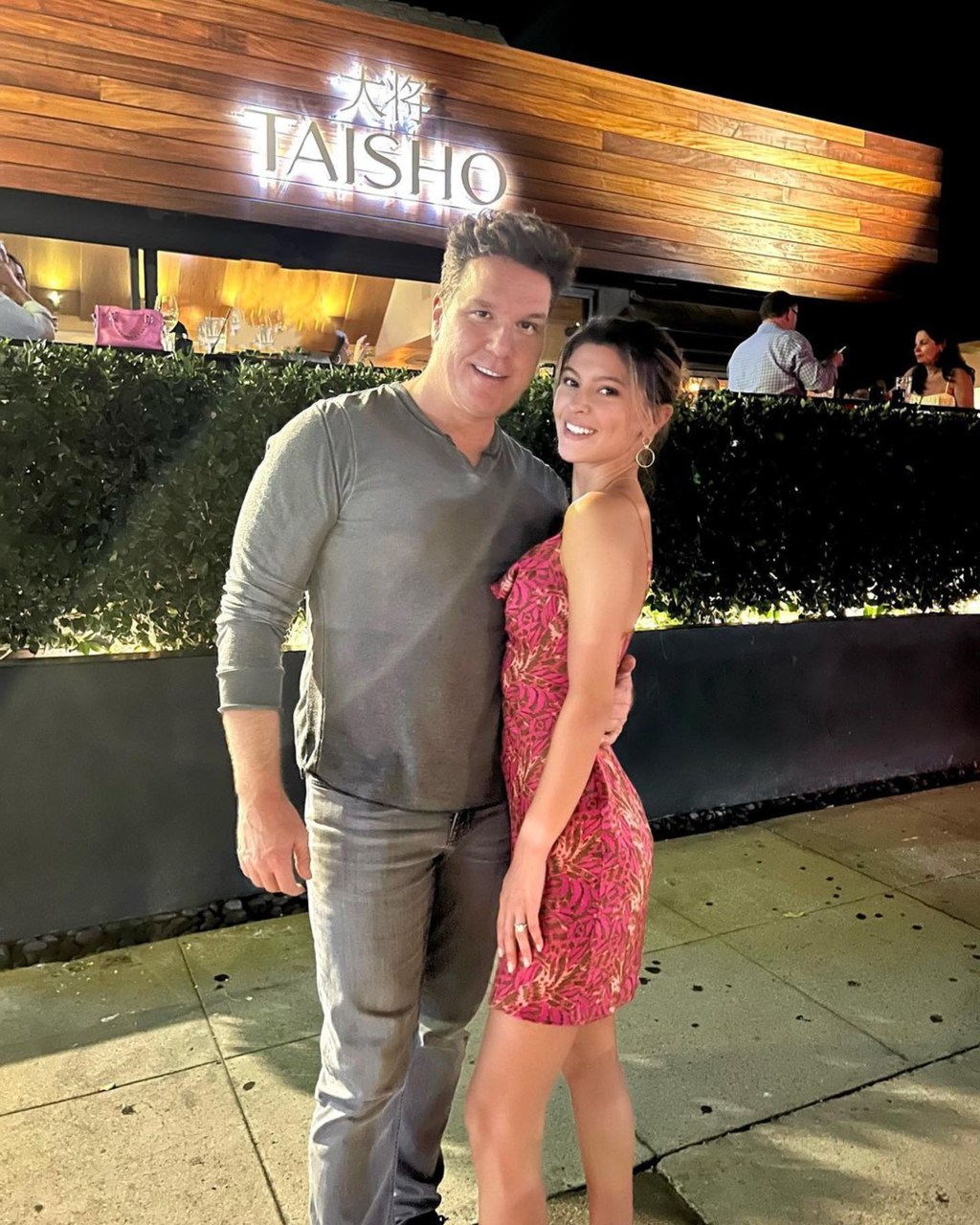 Dane Cook and Kelsi Taylor posing in front of Taisho restaurant in Sherman Oaks, Calif.