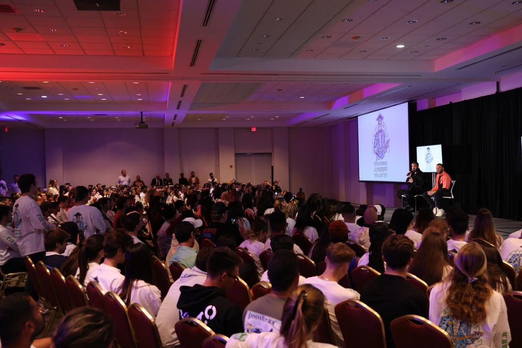 Students listening to Drake speak at Florida International University.