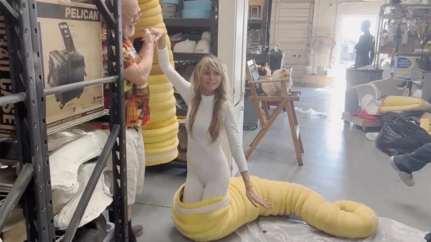 Heidi Klum getting ready for her worm Halloween costume.