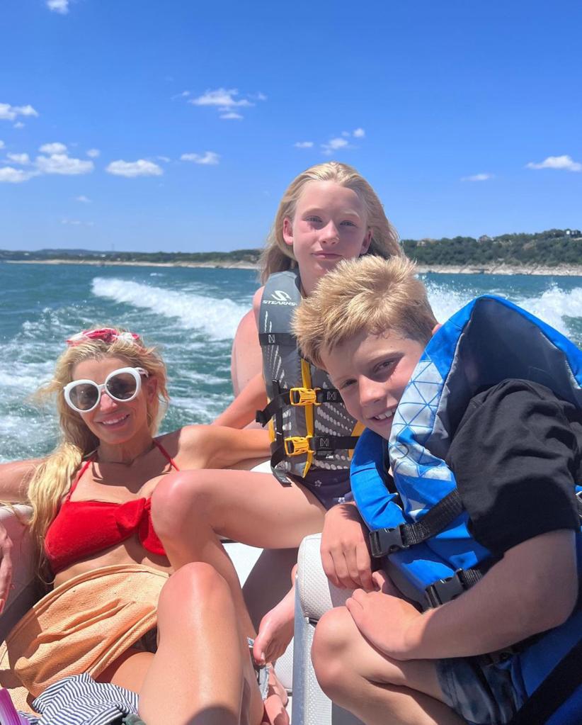 Jessica Simpson lounging on a boat with two of her children.