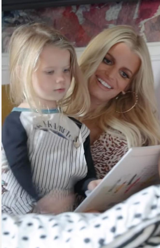 Jessica Simpson reading a book to her daughter Birdie.