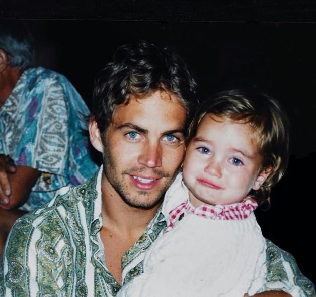 Paul Walker holding Meadow Walker as a baby.