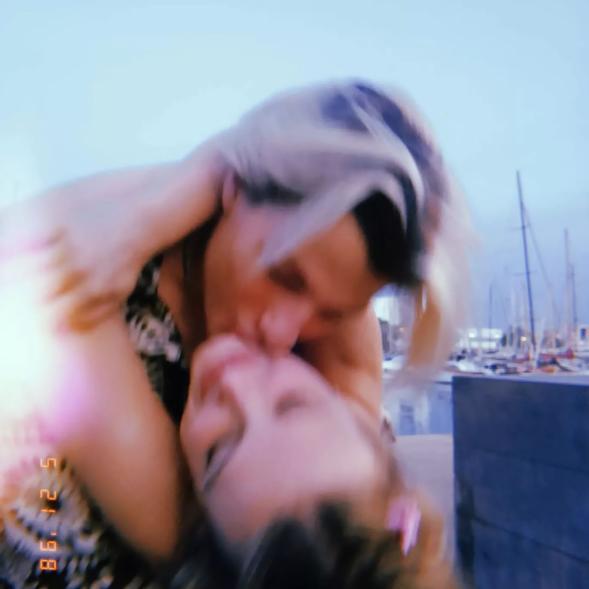 Millie Bobby Brown and Jake Bongiovi kissing.