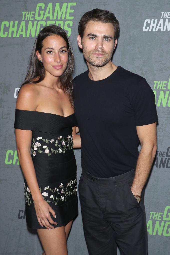 Ines de Ramon and Paul Wesley on a red carpet. 