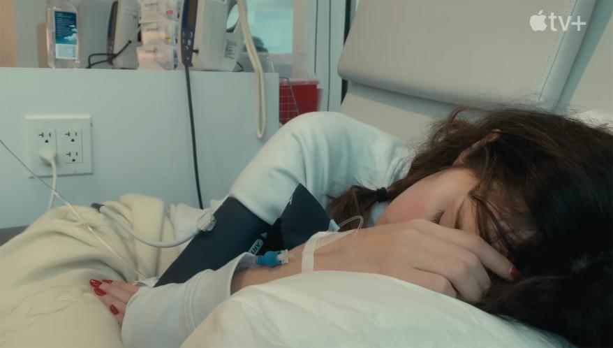 Selena Gomez sleeping while undergoing an IV treatment.