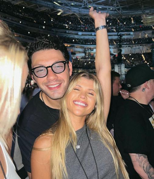 Sofia Richie and Elliot Grainge dancing at a concert