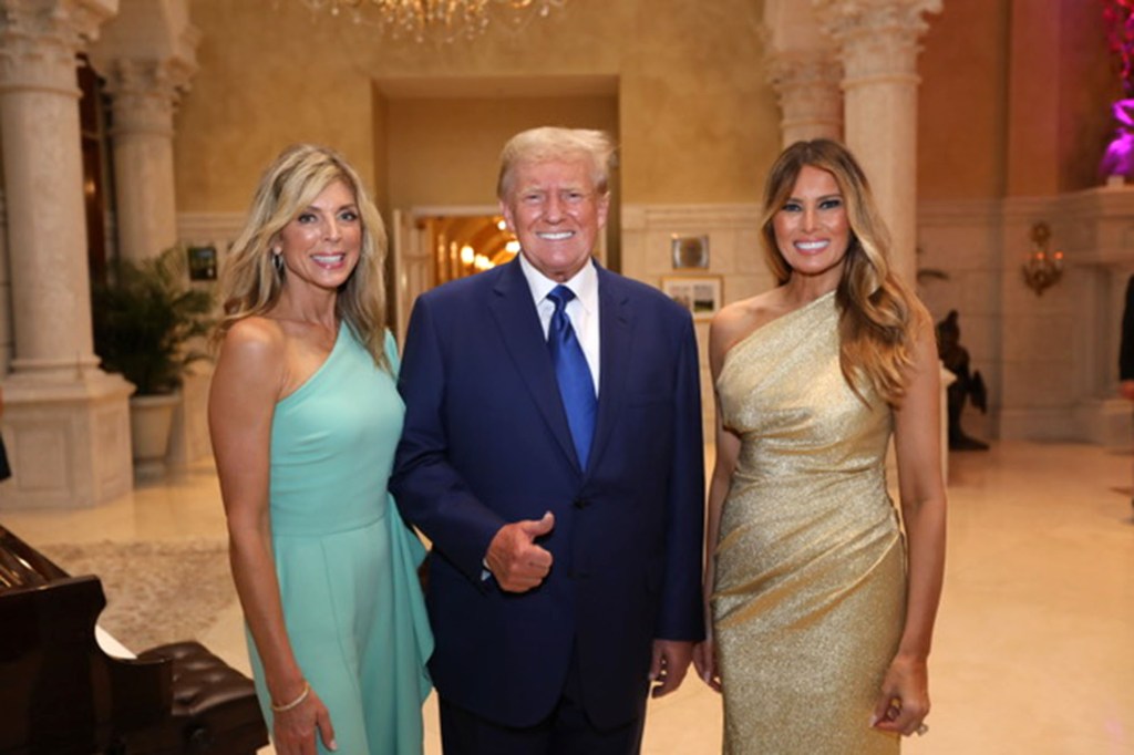 Marla Maples, Donald Trump and Melania Trump posing for a photo together.