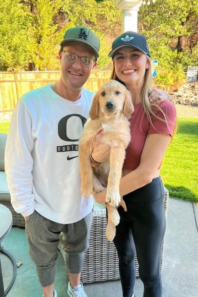 Zachary Ty Bryan and fianceé Johnnie Faye with their dog.