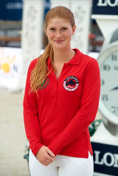 Jennifer Gates smiles in red