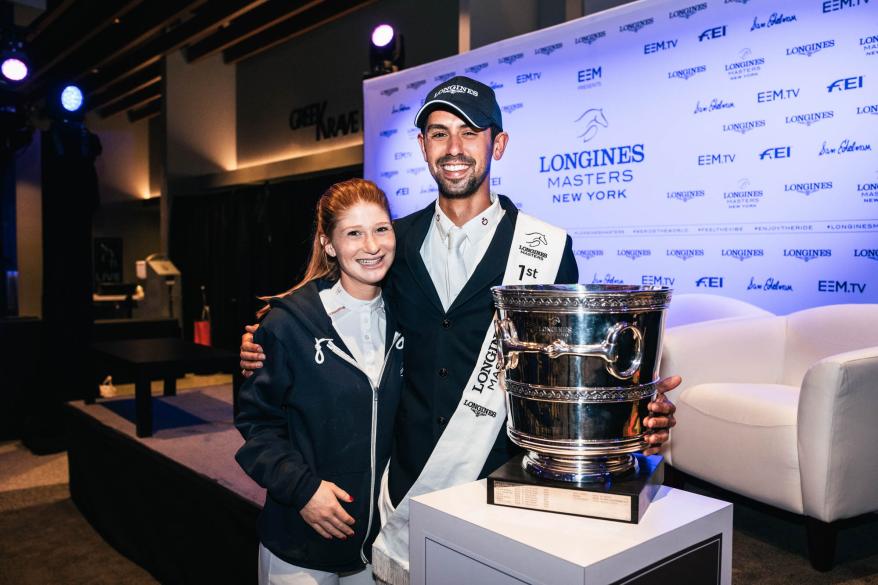 Jennifer Gates' husband, Nayel Nassar, poses with a trophy