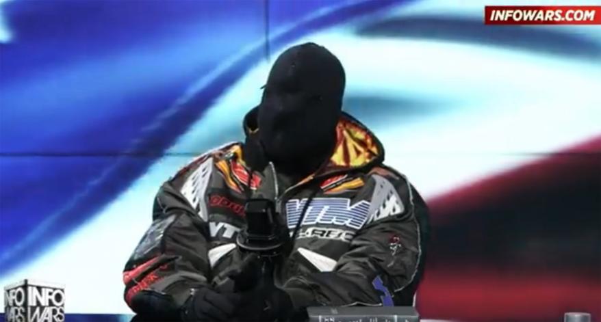 Kanye West on "InfoWars" with his face covered with black fabric.
