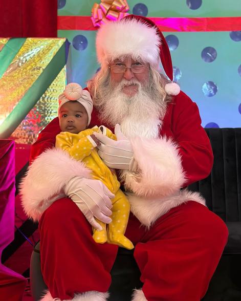 Baby Onyx sitting on Santa's lap